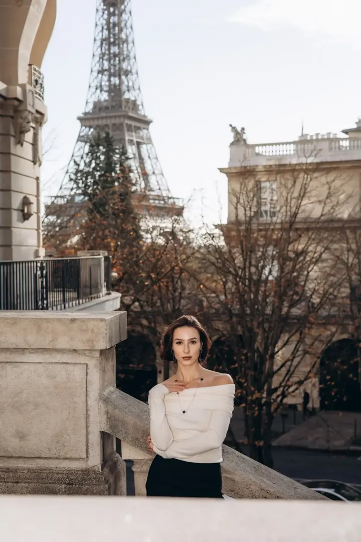 Woman Eiffel Tower balcony Paris portrait