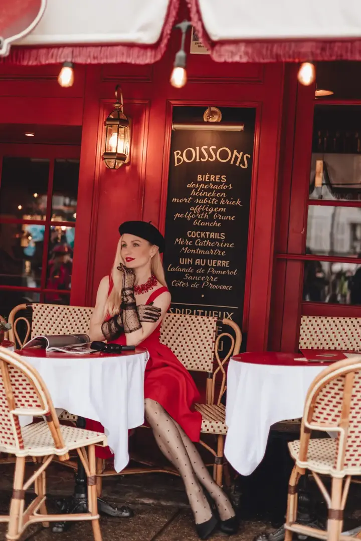 Blonde woman red dress Paris cafe editorial portrait